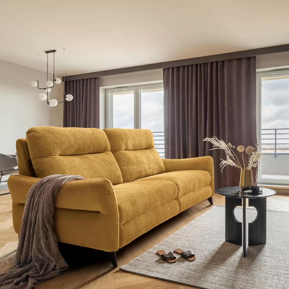 sofa relax modelo taormina en un salón acogedor de tonos neutros disponible en Sidivani