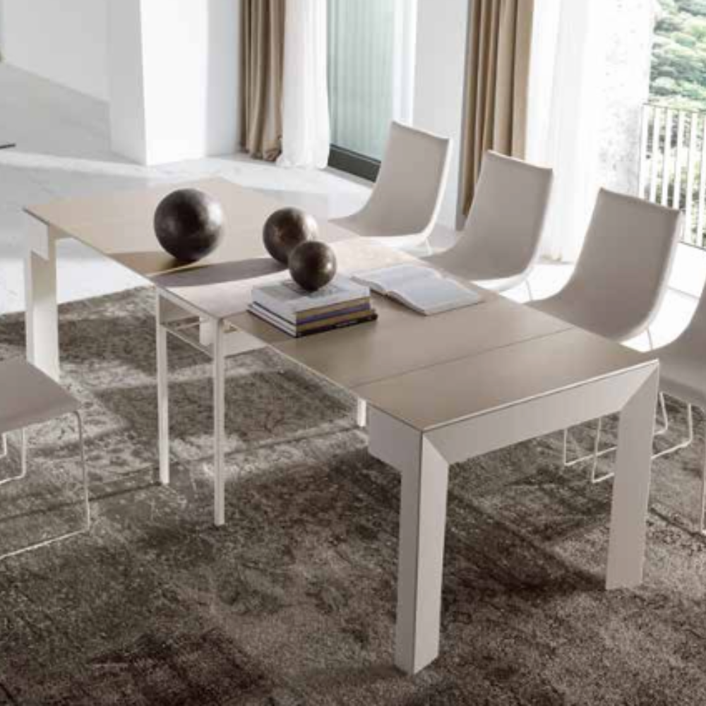 consola convertible en mesa de comedor convertida en mesa con los dos extensibles