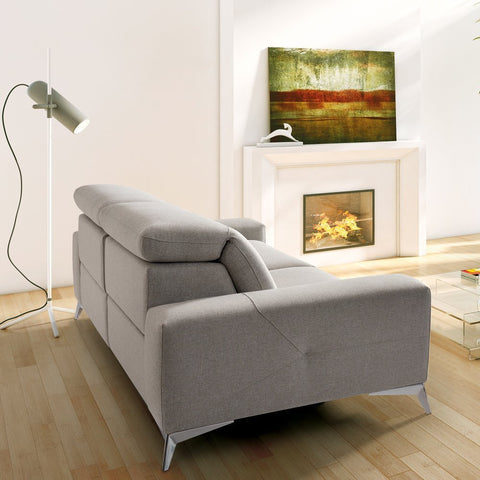 Sofa de diseño modelo LAGOH con asientos relax y cabezales electricos